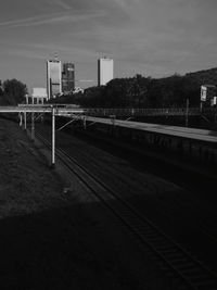 View of railway tracks with buildings in background