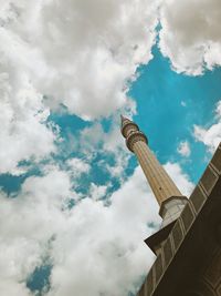 Low angle view of building against cloudy sky