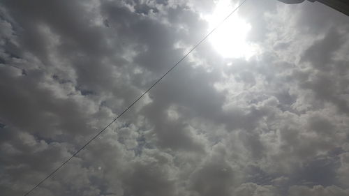 Low angle view of cables against sky