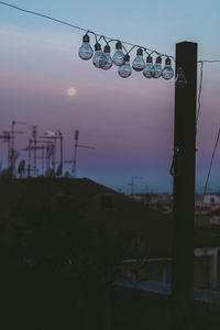 Street light against sky at dusk