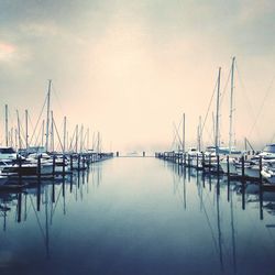 Boats moored at harbor