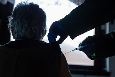 Cropped hand of doctor examining patient