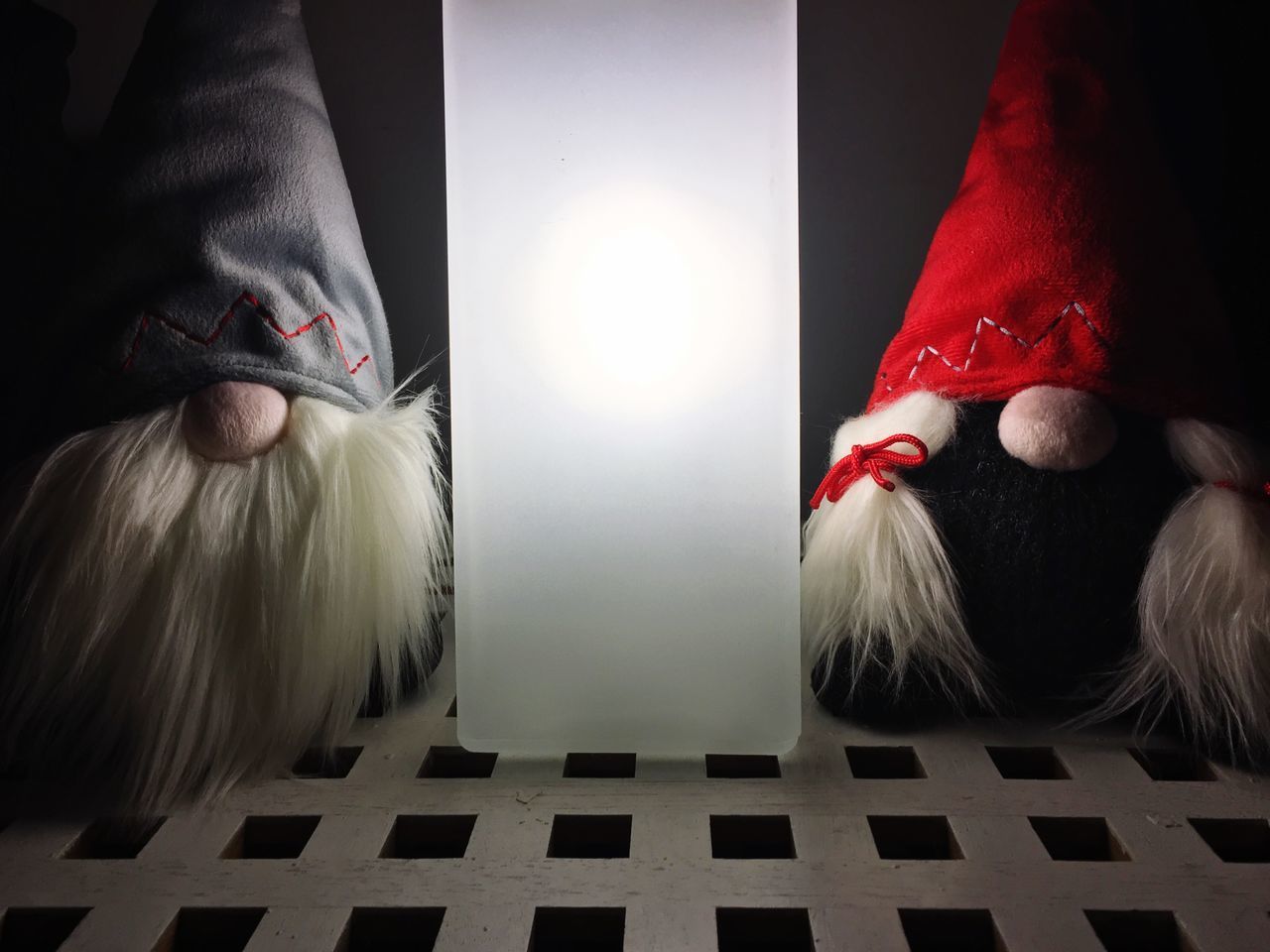 CLOSE-UP REAR VIEW OF WOMAN WITH REFLECTION ON ILLUMINATED MIRROR