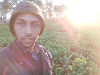 Portrait of young man on field