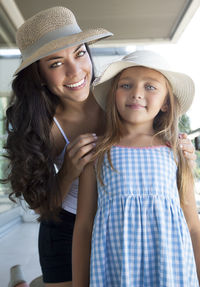 Portrait of a smiling girl wearing hat