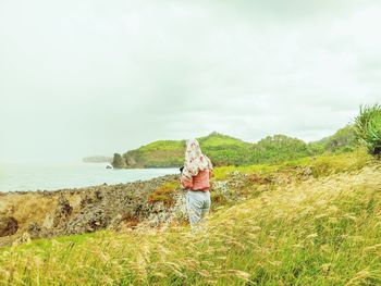 Full length of man on shore against sky