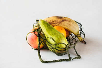 Close-up of fruit against white background