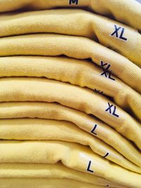 Full frame shot of yellow t-shirts