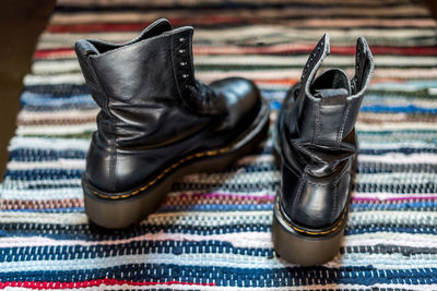 Close-up of shoes on carpet