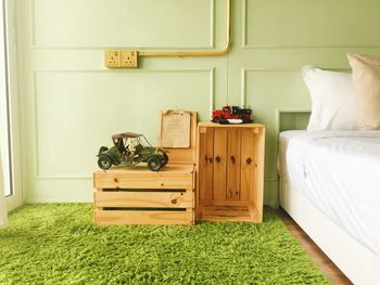 Wooden crates on rug in bedroom