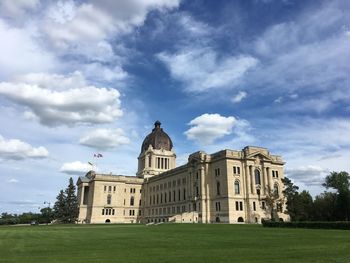 Low angle view of building against cloudy sky