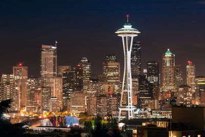 Illuminated buildings in city at night