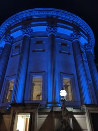 Low angle view of illuminated building at night