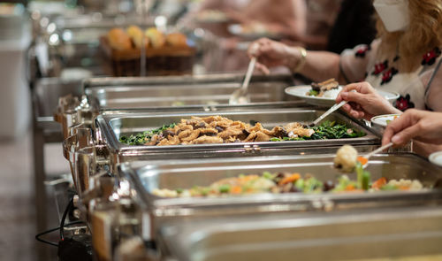 Midsection of man preparing food