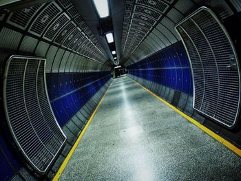 Illuminated tunnel at subway station