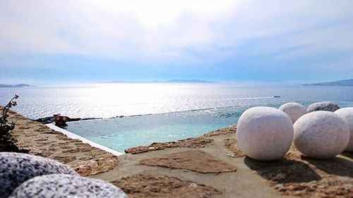 Scenic view of sea against cloudy sky