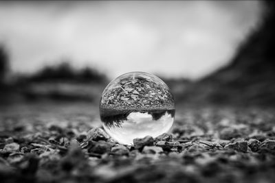 Close-up of crystal ball on field