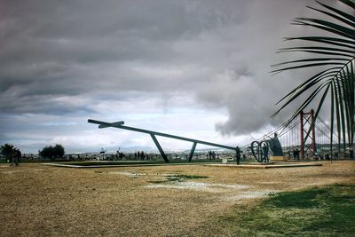 Cranes against sky