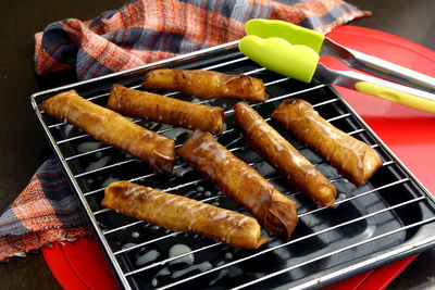 High angle view of meat on barbecue grill