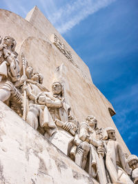 Low angle view of statue against sky