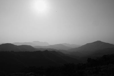 Scenic view of silhouette mountains against clear sky