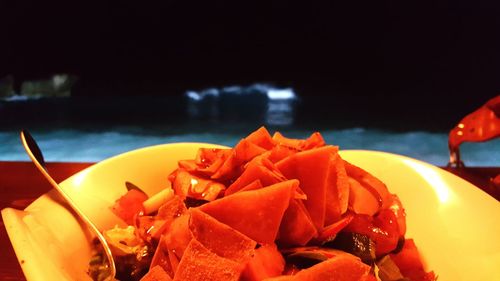 Close-up of fresh orange slices in plate on table