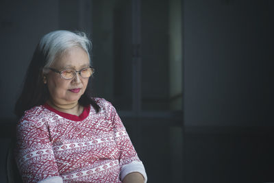 Close-up of senior woman with eyes closed at home