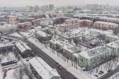 High angle view of buildings in city during winter