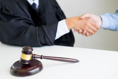 Close-up of hands on table
