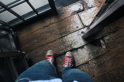 Low section of man standing on floor