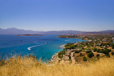 Scenic view of sea against clear blue sky