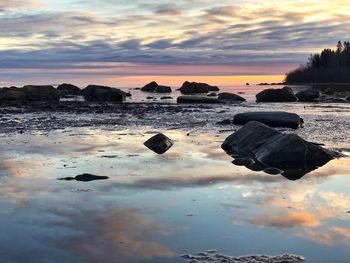 Scenic view of dramatic sky over landscape during sunset