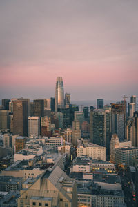 Aerial view of buildings against sky during sunset