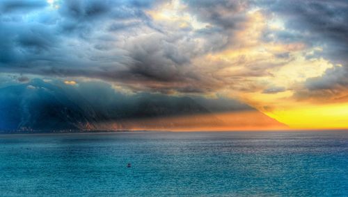 Dramatic sky over sea during sunset