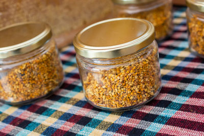 Close-up of beer in glass jar on table