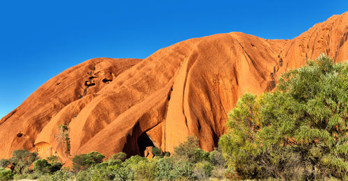 Scenic view of rock formation against clear blue sky