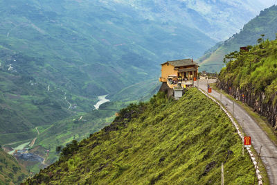 High angle view of road amidst trees and mountains