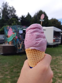 Midsection of woman holding ice cream