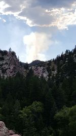 Scenic view of mountains against cloudy sky