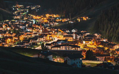 High angle view of illuminated buildings in city at night