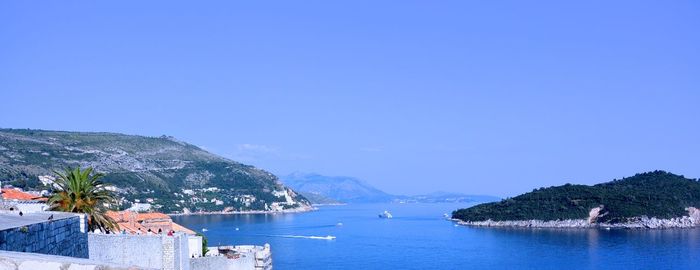 Scenic view of sea with mountains in background