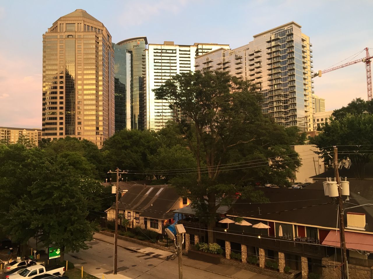 building exterior, architecture, built structure, city, reflection, tree, water, waterfront, modern, skyscraper, building, sky, office building, outdoors, tall - high, river, city life, lake, day, no people