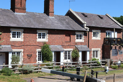 Houses in city against sky