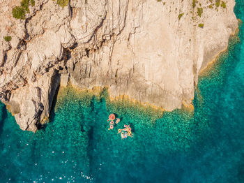 Aerial view of rock formations in sea