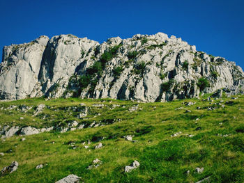 Scenic view of rocky mountains against clear sky