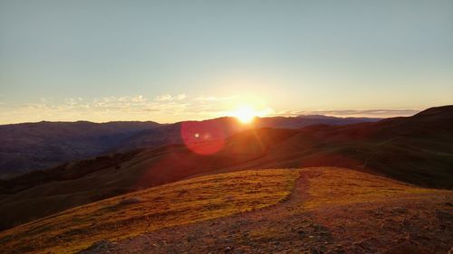 Scenic view of mountains against sky during sunset