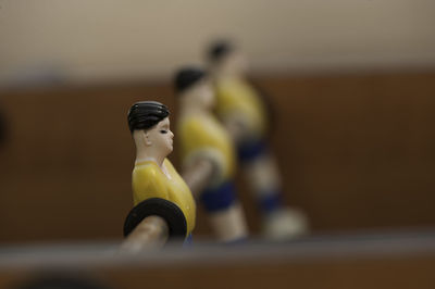 Close-up of figurines on foosball table