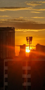 Silhouette of building at sunset