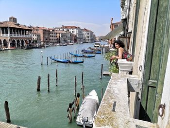 People on boat in city