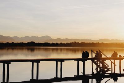 Scenic view of lake against sky during sunset